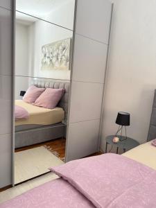 Posteľ alebo postele v izbe v ubytovaní Apartman ANA