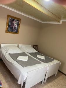 A bed or beds in a room at Vakho house
