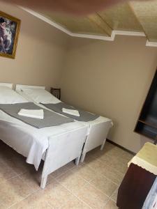 A bed or beds in a room at Vakho house