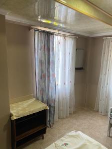 A bed or beds in a room at Vakho house