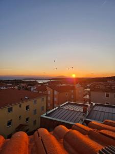 Sončni vzhod oz. zahod, fotografiran iz apartmaja oz. okolice
