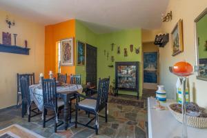 a dining room with a table and chairs at Villa 'SeaRock' apartment at Amoni Corinth in Pefkali +19 photos