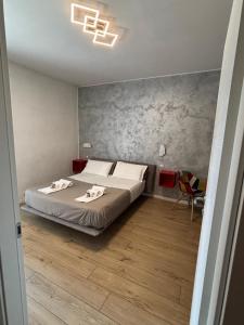 Posteľ alebo postele v izbe v ubytovaní san rocco apartments