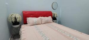 Кровать или кровати в номере Nuha Homestay Kuala Terengganu +4 фотографии