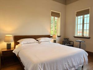 Gulta vai gultas numurā naktsmītnē Xiamen Gulangyu Bishan Residence
