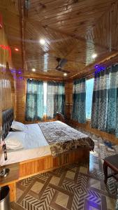 a bedroom with a large bed in a room at Maya Homestay & Cafe in Kasol +66 photos