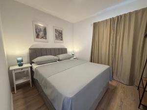 Postel nebo postele na pokoji v ubytování The Horizon