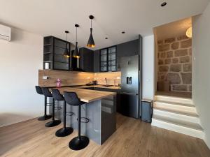 Kuchyň nebo kuchyňský kout v ubytování The Horizon