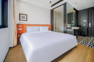 Letto o letti in una camera di Chenfeng Hotel Jingdezhen Taoyangli People's Square Branch