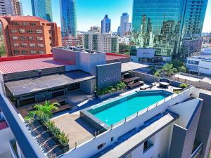 an aerial view of a building with a swimming pool at Modern Studio Equipetrol in Santa Cruz de la Sierra