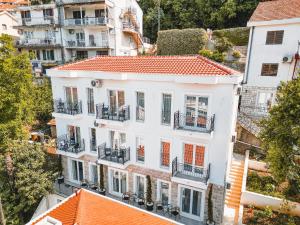 an aerial view of a white building with orange roofs at Casa M- Studio #1 - Brand New in Herceg-Novi