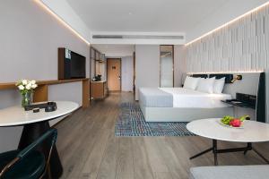 TV a/nebo společenská místnost v ubytování Huizhou Zhongkai Hi-Tech Zone Meihua Hotel