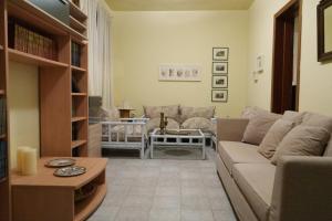 a living room with a couch and a table at Bella Casa in Alexandroupoli