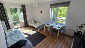 a living room with a couch and a table at Apartament VERDE Malbork centrum in Malbork