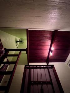 a room with two bunk beds and a fan at Redang Campstay A Frame in Redang Island