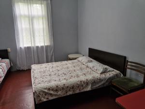 Postel nebo postele na pokoji v ubytování Joni Guest House