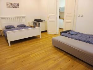 Posteľ alebo postele v izbe v ubytovaní Pat & Mat Apartment