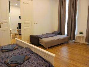 Posteľ alebo postele v izbe v ubytovaní Pat & Mat Apartment