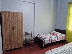 Postel nebo postele na pokoji v ubytování Joni Guest House