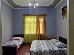Postel nebo postele na pokoji v ubytování Joni Guest House