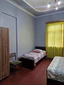 Postel nebo postele na pokoji v ubytování Joni Guest House