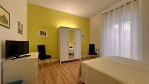 TV a/nebo společenská místnost v ubytování L'arancio B&B