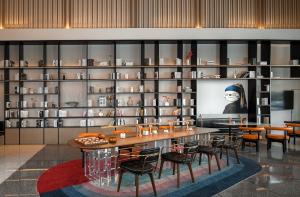 TV a/nebo společenská místnost v ubytování Huizhou Zhongkai Hi-Tech Zone Meihua Hotel