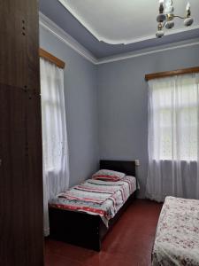 Postel nebo postele na pokoji v ubytování Joni Guest House