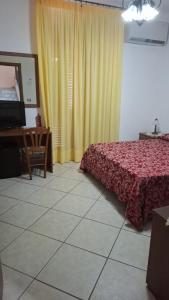 Postel nebo postele na pokoji v ubytování Hotel Savoia