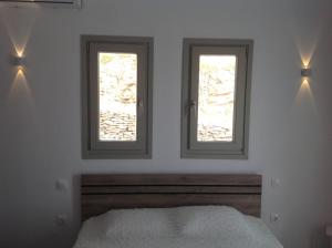 Postel nebo postele na pokoji v ubytování Liopi Village Andros
