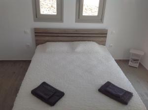 Postel nebo postele na pokoji v ubytování Liopi Village Andros