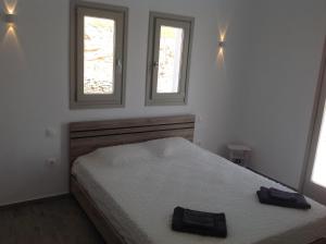 Postel nebo postele na pokoji v ubytování Liopi Village Andros