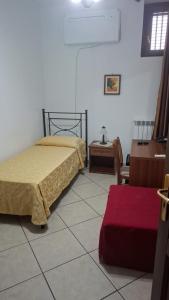 Postel nebo postele na pokoji v ubytování Hotel Savoia
