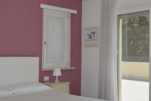 Postel nebo postele na pokoji v ubytování B&B Terra del Sole