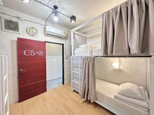 Ένα ή περισσότερα κρεβάτια σε δωμάτιο στο Salee Hostel