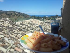 a plate of food on a table with a view at Enjoy Badolato! in Badolato