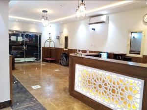 a large room with a lobby with a reception counter at سمو الخير in Haradh Camp