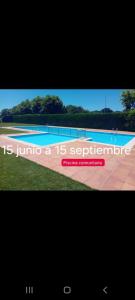 a television screen with a picture of a swimming pool at O Alecrin de Bouzas Ribeira Sacra in Pereiro de Aguiar