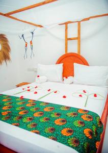 Postel nebo postele na pokoji v ubytování Kilimanjaro + 28 fotografií