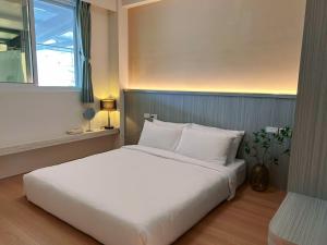 Postel nebo postele na pokoji v ubytování Orange Homestay