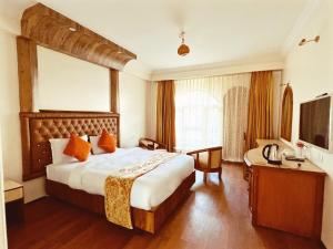 Postel nebo postele na pokoji v ubytování Hotel The Kantipur