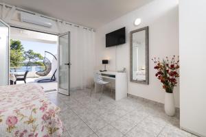 Postel nebo postele na pokoji v ubytování Apartments Dobronic