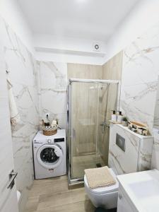 Kuchyň nebo kuchyňský kout v ubytování Sol Greco Apartment