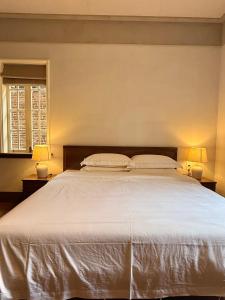 Gulta vai gultas numurā naktsmītnē Xiamen Gulangyu Bishan Residence