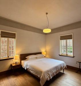 Gulta vai gultas numurā naktsmītnē Xiamen Gulangyu Bishan Residence