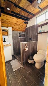 a bathroom with a toilet and a sink at Hotel en Huacas y Brasilito in Matapalo +22 photos