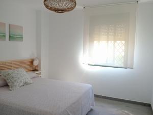 Postel nebo postele na pokoji v ubytování Apartamentos Vacacionales Atlanterra + 37 fotografií
