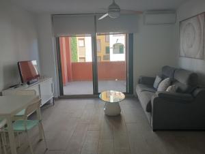 TV a/nebo společenská místnost v ubytování Apartamentos Vacacionales Atlanterra