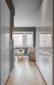 a living room with a couch and a table at Cozy apartment in centrum in Oslo