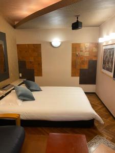 Postel nebo postele na pokoji v ubytování Hotel Takao Asile